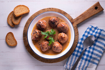 Tapa of beef meatballs with red wine sauce. Traditional Spanish recipe.