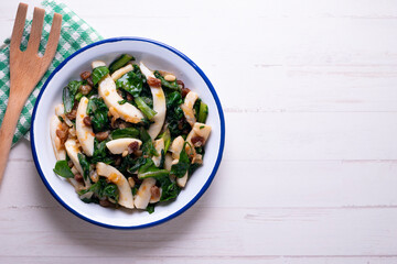 Cuttlefish cooked with chard and spinach. Spanish traditional tapas.