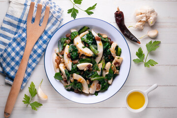 Cuttlefish cooked with chard and spinach. Spanish traditional tapas.