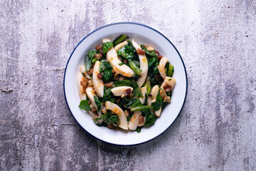 Cuttlefish cooked with chard and spinach. Spanish traditional tapas.