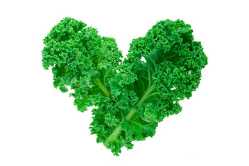 Closeup of some leaves of kale forming a heart on a white background