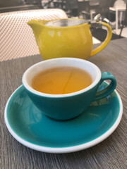 green tea in a cup in a restaurant on the veranda