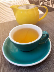 green tea in a cup in a restaurant on the veranda