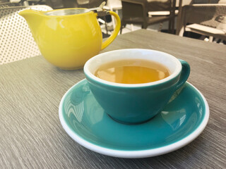 green tea in a cup in a restaurant on the veranda