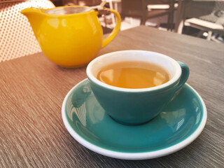green tea in a cup in a restaurant on the veranda