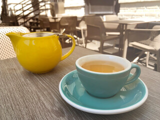 green tea in a cup in a restaurant on the veranda