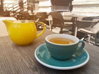 green tea in a cup in a restaurant on the veranda
