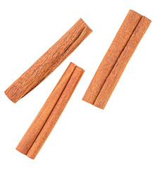 Top view of three cinnamon sticks isolated on a white background. Aromatic dry cinnamon sticks.