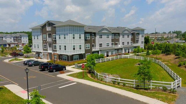 This video shows aerial shots of the new, modern construction apartment complex.