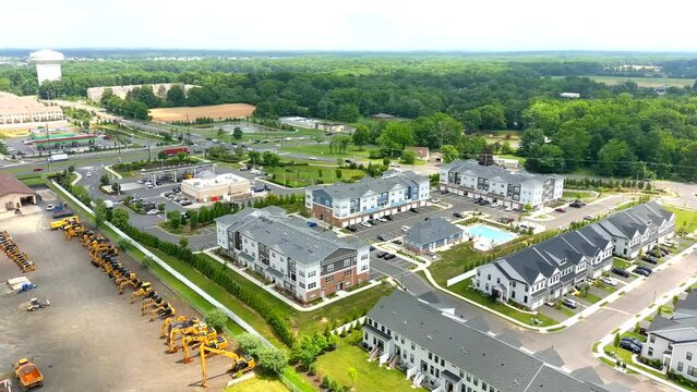 This video shows aerial shots of the new, modern construction apartment complex.
