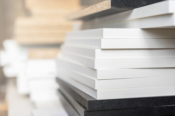 Edges of boards made of laminated chipboard, details of cabinet furniture in the assembly shop.