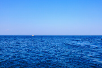 View of the open sea from the yacht. Background with selective focus