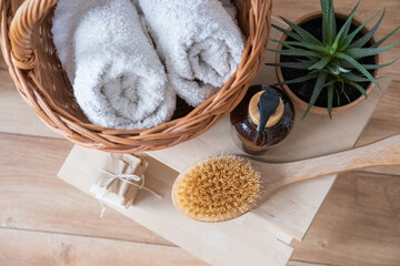 Bath accessories on a wooden bench top view.