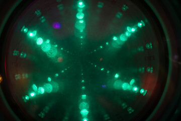 Colorful round party lights equipment. Fun flashing bokeh lights background. Night indoor entertainment.