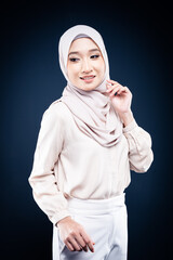 Portrait of Muslim woman in office attire and wearing a hijab. Asian woman in a corporate world. Formal corporate outfit and elegant appearance. Corporate or business people concept. Isolated