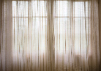 Blurred abstract texture and background of window with curtain.