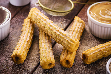 churros, a traditional fried sweet from Latin America, Brazil, Colombia, the United States and Portugal, served with or without filling, sprinkled with sugar