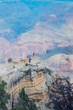 Group Of Kids Walking On The Cliff Of The Grand Canyon In Arizona