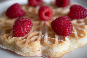 Dessert waffles with raspberries and bananas	