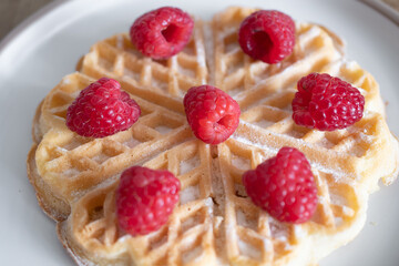 Dessert waffles with raspberries and bananas	