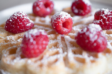 Dessert waffles with raspberries and bananas	