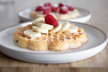 Dessert waffles with raspberries and bananas