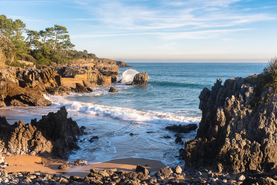 Beautiful long exposure scenic view of the rocky coastline in the Cantabrian sea at dawn, Noja, Cantabria, Spain