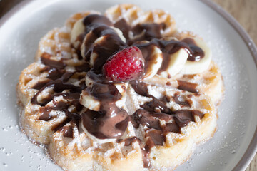 Chocolate-covered banana and raspberry waffles, dessert