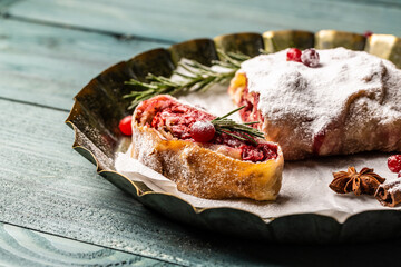 Strudel with a cherry. winter dessert strudel with cherry, cranberries and walnut. Food recipe...