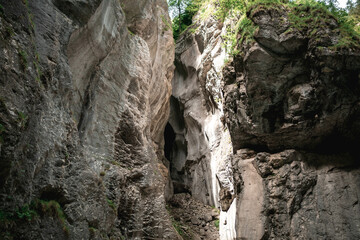 Aare Gorge canyon, blue alpine river between narrow rocky cliffs. Swiss Alps. Aareschlucht Meiringen Switzerland. Section of the river in the Bernese Oberland region o