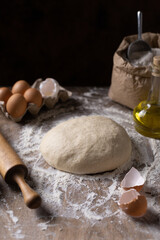 Wheat dough for bread cooking or pastry at table. Homemade bread making on wooden tabletop concept