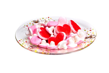 Candy red hearts on a plate isolated