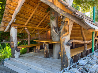 Open rustic wooden hut to celebrate