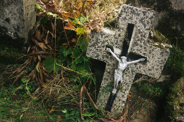 Abandoned grave cementary. Graveyard rusty cross. All saints holiday cleaning up. Symbolic...