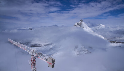Iconic summit Matterhorn viewed from Klein Matterhorn platform on a sunny cold day. Construction...