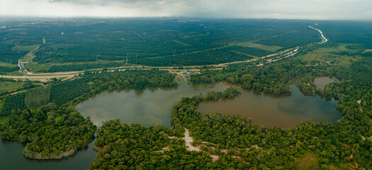 Aerial drone view of tropical scenery with dam lake at Jasin, Melaka, Malaysia