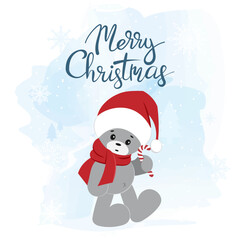 A teddy bear in a Santa Claus hat. Christmas greeting card.