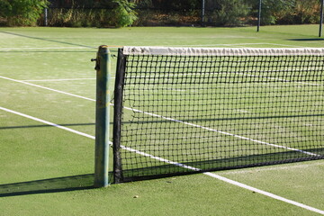 Game net on a tennis and pickle ball court