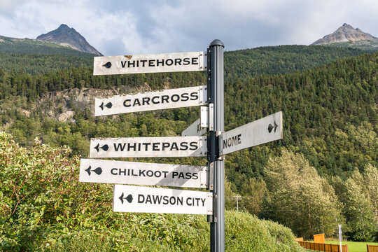 Directional signpost pointing to towns near Skagway, Alaska