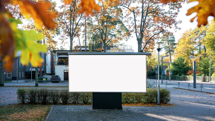 Big empty white billboard with mock up space mounted at urban street in autumn season outdoor