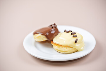 Glazed chocolate and vanilla pancakes in a plate