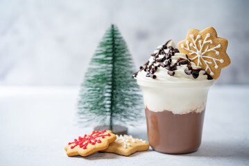 Chocolate cocktail or dessert with whipped cream with christmas cookies for Christmas
