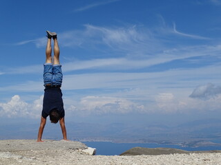 Handstand at the top of the Pantokratos mountain in Corfu, Greece