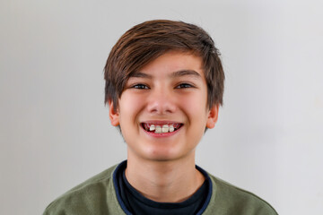 Children tooth care and hygiene. Portrait of a teenager boy with diastema overbite teeth missing...
