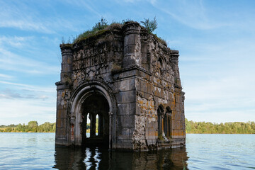 Old flooded ruined abandoned church. Ancient ruins on water
