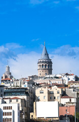 Fototapeta na wymiar Blank advertising sign board around Galata Tower in Istanbul with blue and cloudy sky background.