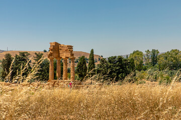 Agrigento, Sicily, Italy - July 12, 2020: Temple of Castor and Pollux, one of the Greek temples of Italy, Magna Graecia. The ruins are the symbol of the city of Agrigento in Sicily