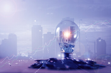 Double exposure of city and stack of coins with light bulb for idea to finance and business concept, Saving money, Finance and banking, Future income planning.