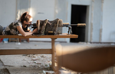 female sniper with a rifle