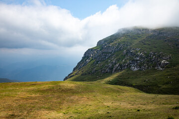 Mountain peak hidden under the clouds